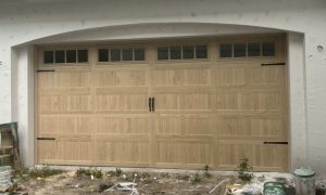 CHI 5283 Stamped Carriage House Garage Door in Natural Oak Accent Woodtone with Long Plain Windows and Madison Decorative Inserts